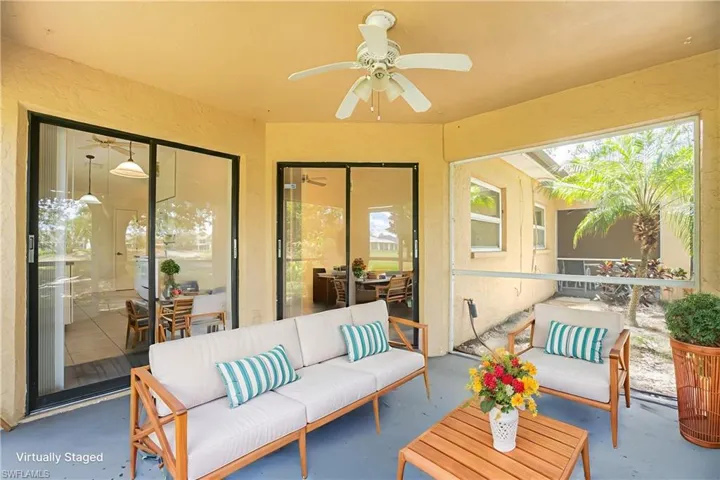 Sunroom featuring outdoor lounge area, a ceiling fan, and plenty of natural light