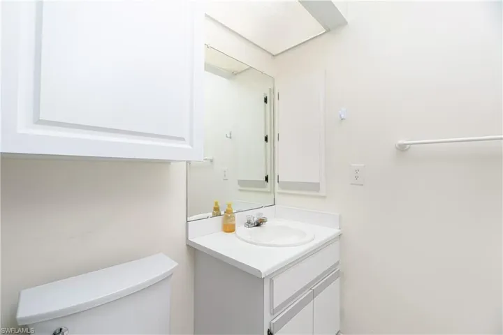 Half bath with vanity and toilet