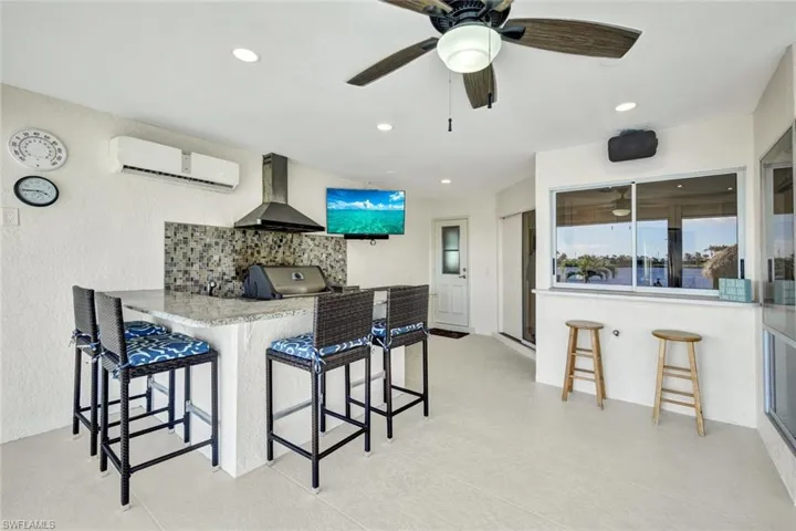 Awesome vented outdoor kitchen with outdoor custom sonos speakers