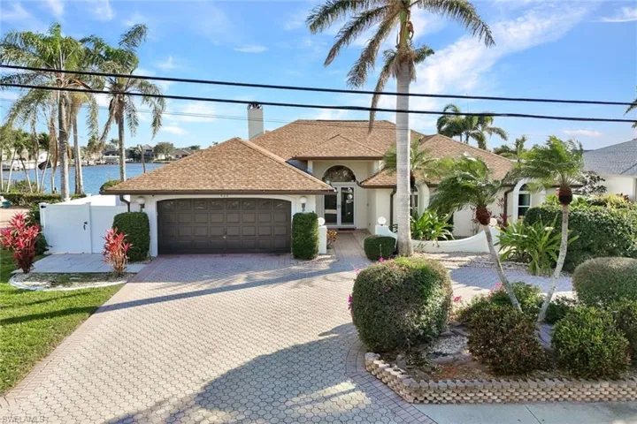 Mature landscaping  withmature palm trees and greenery