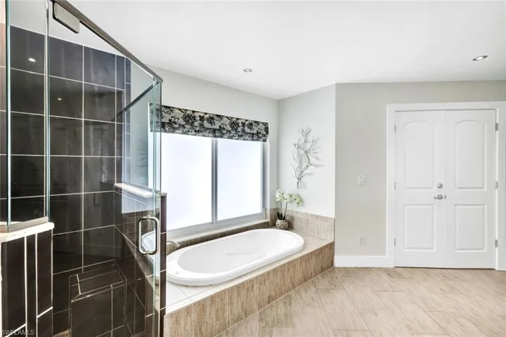Large soaker tub with separate shower