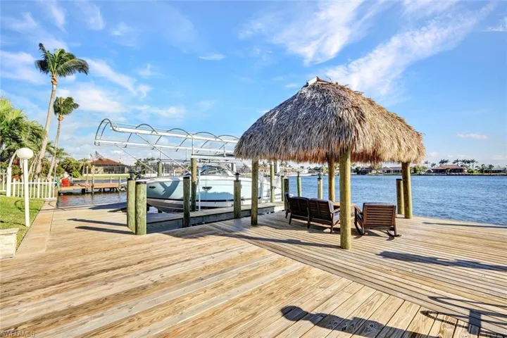 Covered boat lift with Captains dock is ready for your boat to call it home