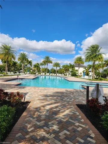 Community pool featuring a patio