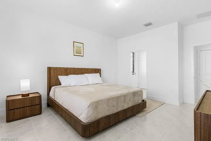 Bedroom featuring light tile patterned flooring