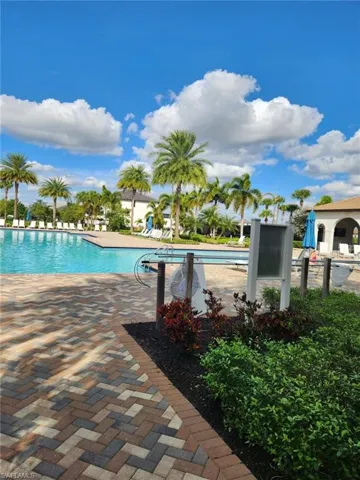 Community pool with a patio area