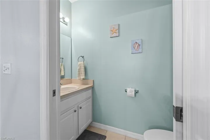 Bathroom featuring vanity and light tile patterned floors