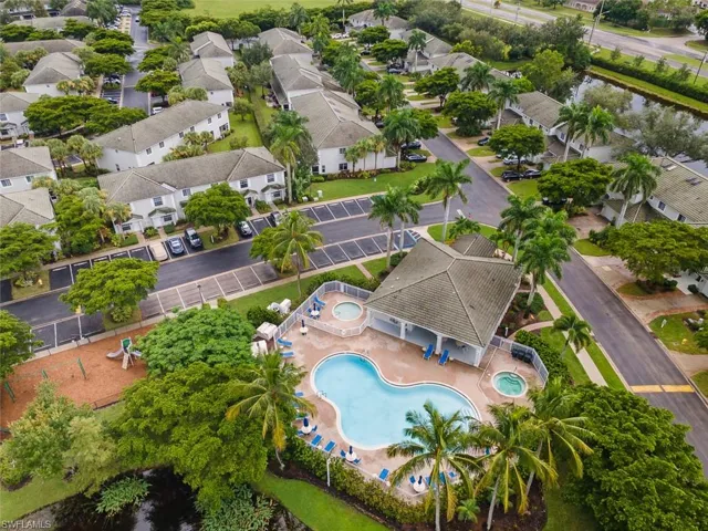 Aerial view of residential area featuring a pool