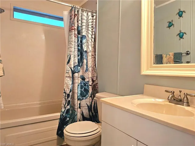 Full bathroom with vanity and shower / bath combo