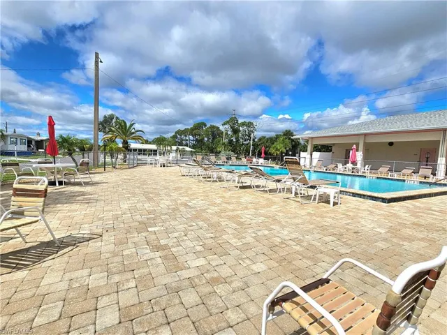 Community pool featuring a patio area