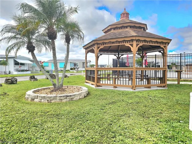 Dock area with a gazebo and a patio