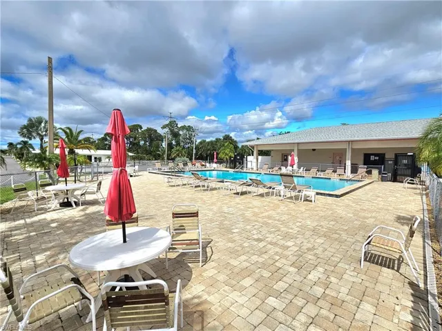 Community pool with a patio