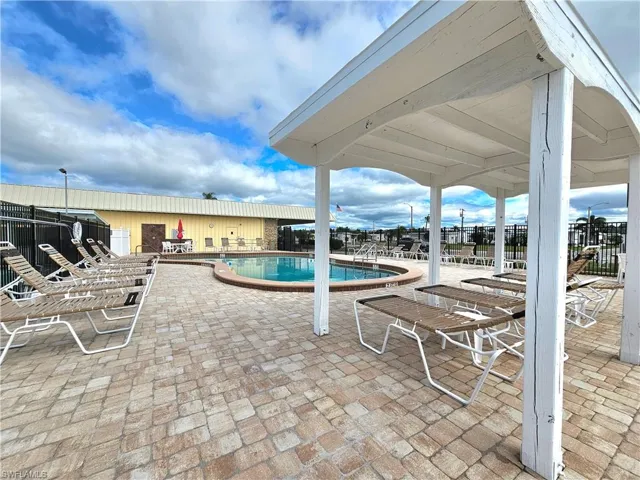 Community pool featuring a patio