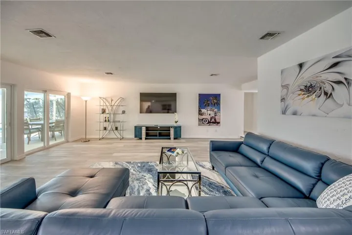 Living room featuring baseboards and light wood-style flooring