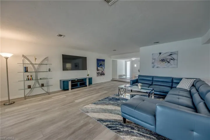 Living area with wood finished floors and baseboards