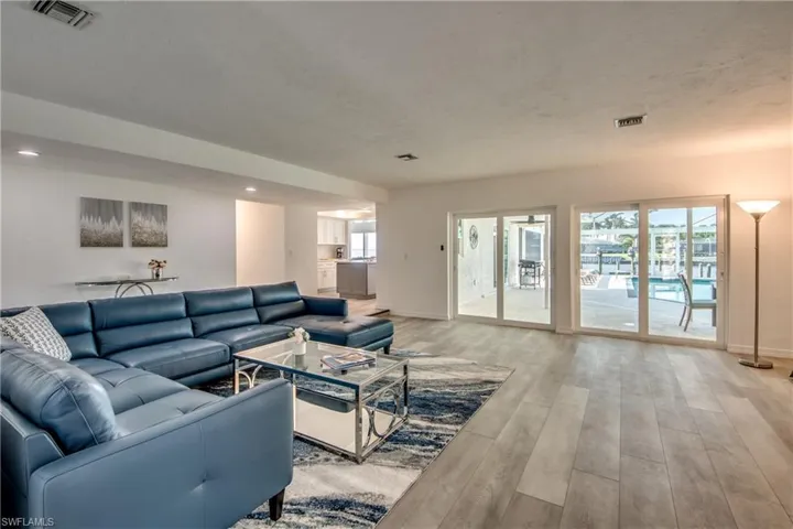 Living room featuring light wood-style floors and baseboards