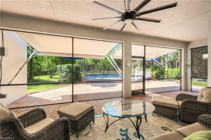 BRICK PAVER DECK, SCREENED INDOOR PORCH, OPEN OUTDOOR PORCH HAS RETRACTABLE AWNINGS