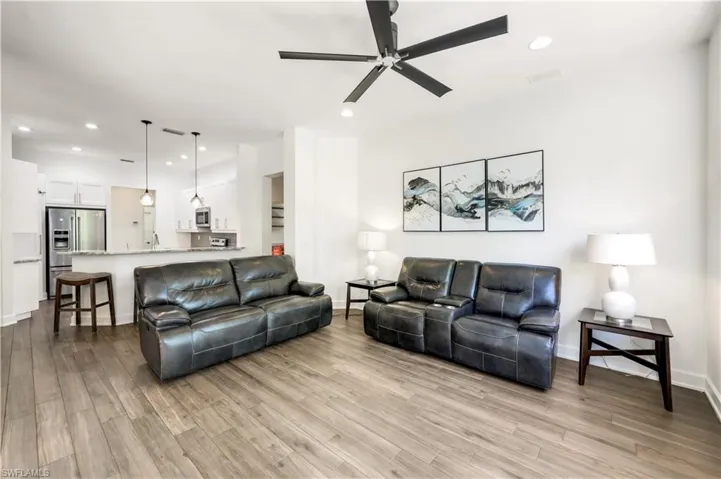 KITCHEN OPENS TO FAMILY ROOM, WHICH OPENS TO PORCH AND POOL
