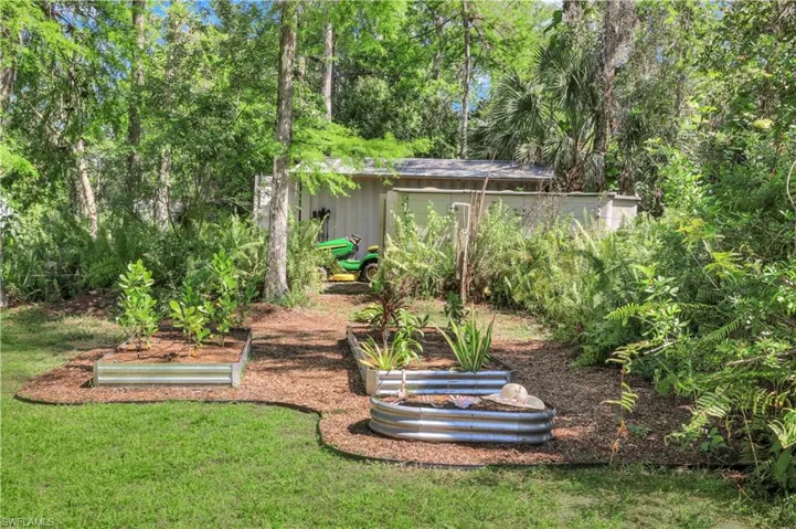 IRRIGATED GARDEN BEDS, JOHN DEERE RIDING MOWER INCLUDED
