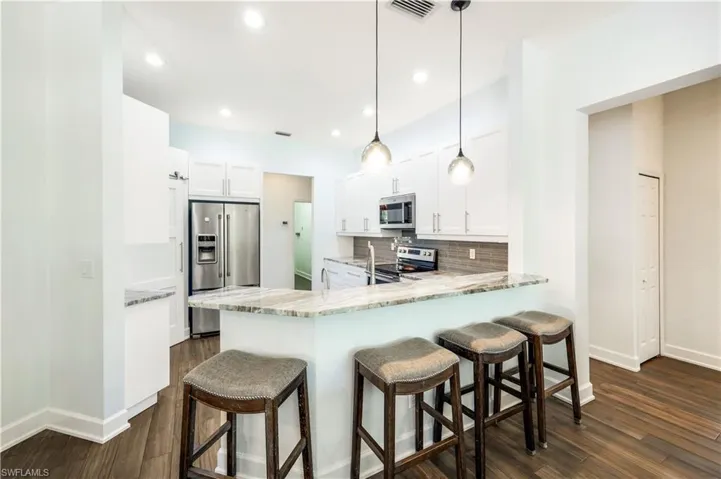 WHITE BRIGHT KITCHEN IS THE HUB OF THE HOME