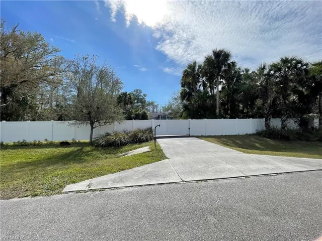PRIVATE SECURE WHITE FENCE WITH ENTRY CODE AND SLIDING GATE