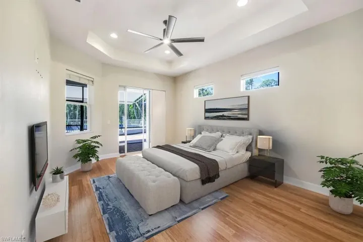 THIS MAIN BEDROOM IS VIRTUALLY STAGED (ROOM IS EMPTY), LEADS TO PORCH
