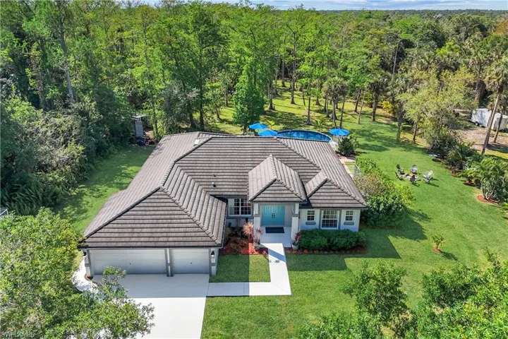 4 BEDROOM, 2 BATH, 3 CAR GARAGE POOL HOME NESTLED ON 2.73 ACRES