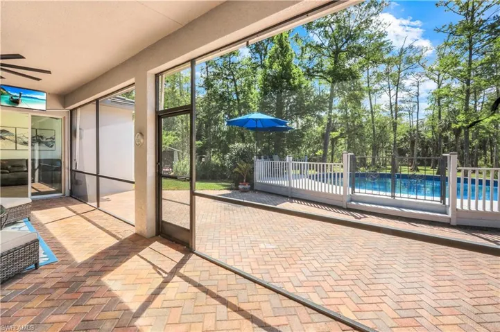 BRICK PAVER PORCH IS SCREENED INSIDE AND HAS AWNINGS OUTSIDE