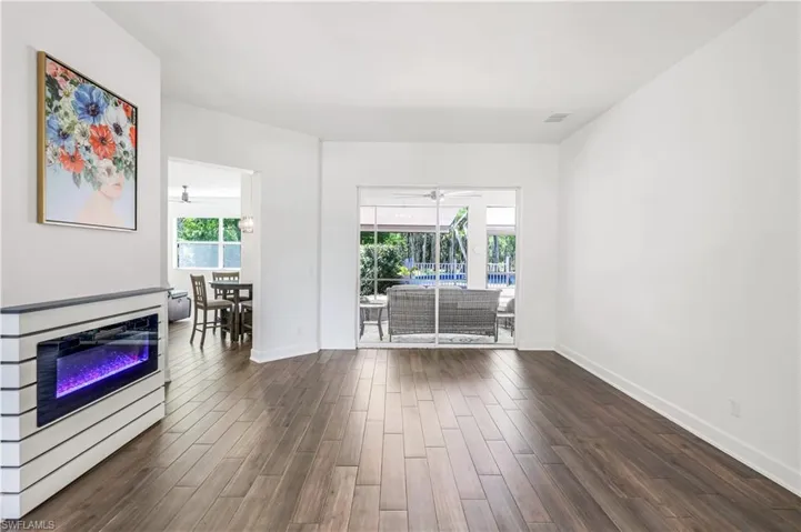 LIVING ROOM HAS ELECTRIC FIREPLACE,  FLOWS FROM DINING ROOM TO KITCHEN & FAMILY ROOM