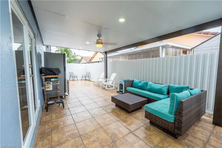 Fenced backyard with a patio area, area for grilling, and outdoor lounge area