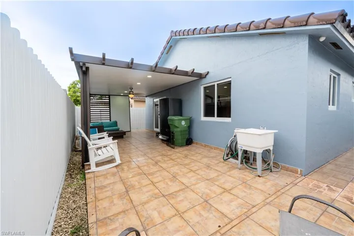 Fenced backyard featuring a patio