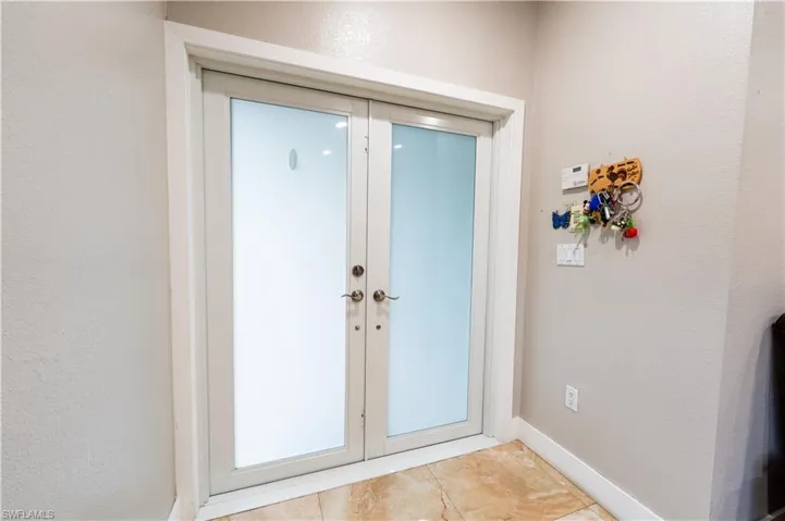 Doorway featuring french doors