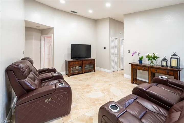 Living area featuring recessed lighting and baseboards