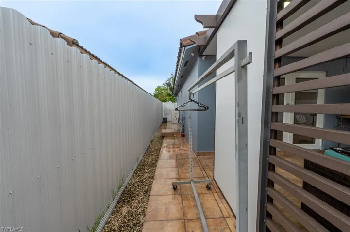 View of side of property featuring a fenced backyard