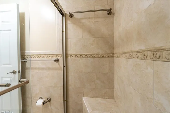 Full bathroom featuring tiled shower