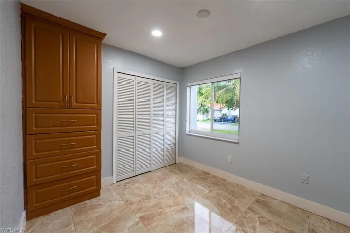 Unfurnished bedroom with a closet and recessed lighting