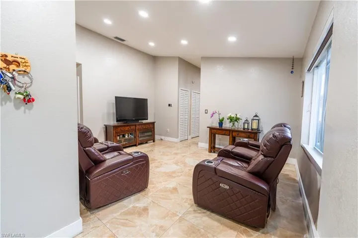 Living room featuring recessed lighting and healthy amount of natural light