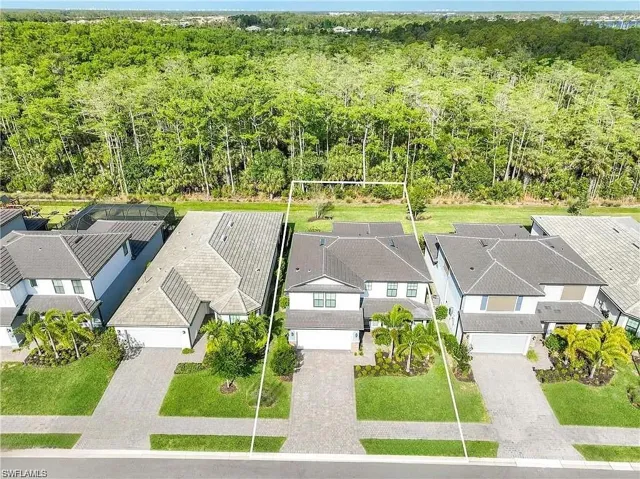 Aerial view of residential area with a forest