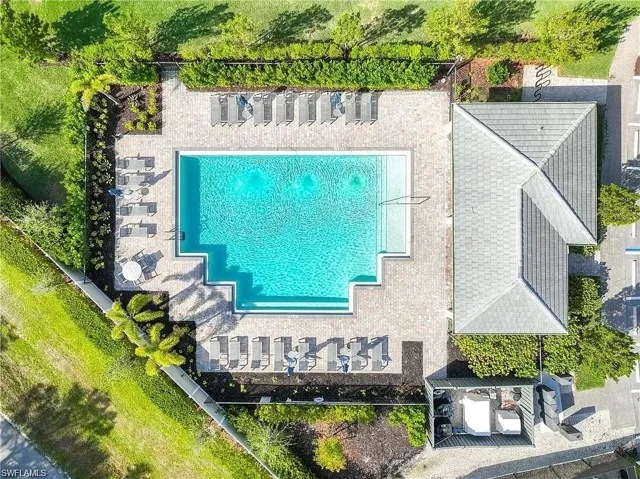 View of subject property with a pool