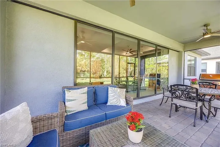 Sunroom / solarium featuring ceiling fan, outdoor dining area, and an outdoor living space