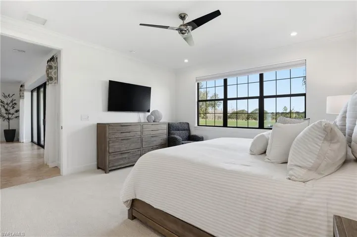 Bedroom featuring carpet flooring, ornamental molding, a ceiling fan, and recessed lighting