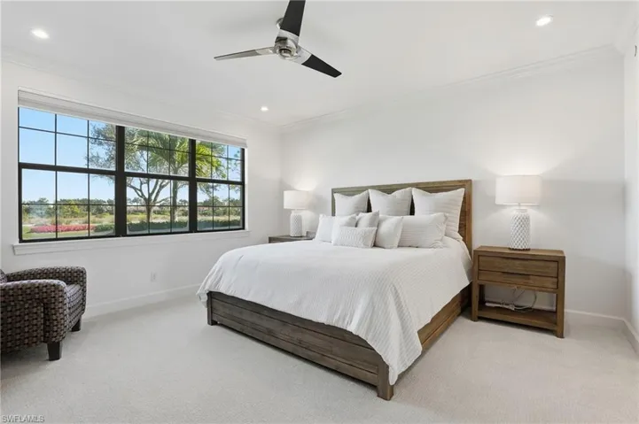 Bedroom featuring light colored carpet, a ceiling fan, crown molding, and recessed lighting