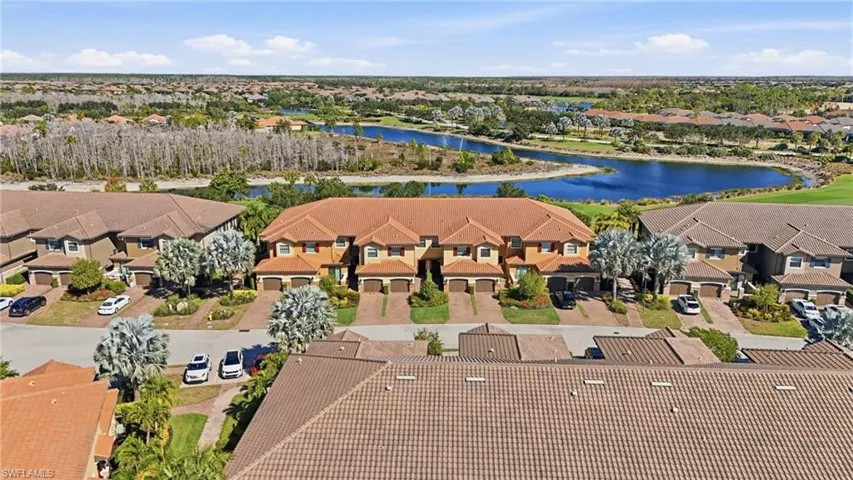 Aerial view of residential area featuring a large body of water