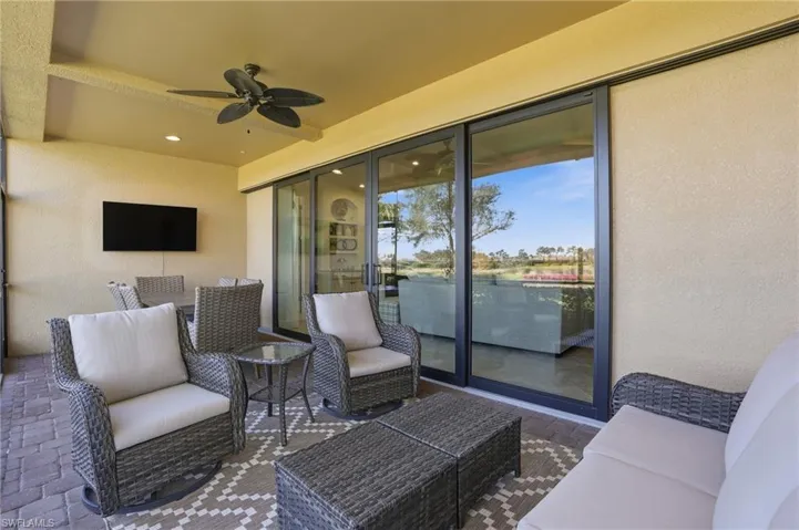 View of patio featuring ceiling fan and an outdoor hangout area