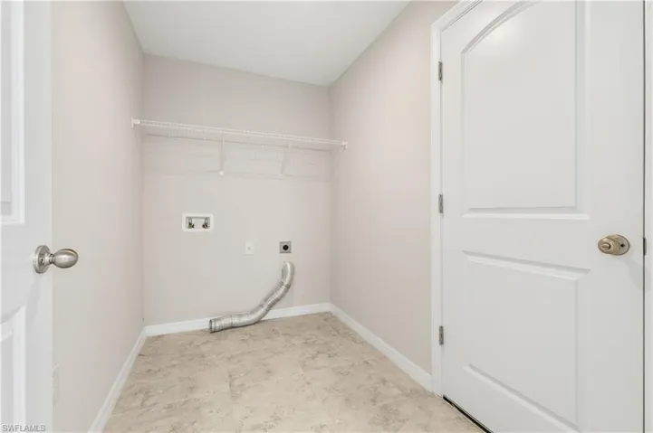 Laundry area featuring hookup for an electric dryer and washer hookup