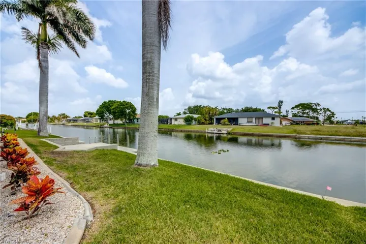 Well kept, well manicured backyard with Concrete Boat Dock, Royal Palm Trees!!!