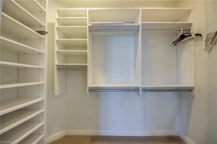 The Master Bedroom closet features Custom Build In's and extra Shelving.  The extra High Ceiling offers extra Storage Space