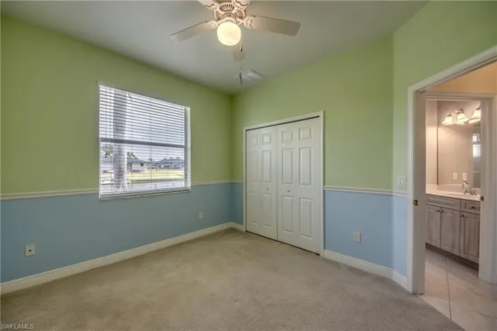 Guest Bedroom #2 is a nice size with a view of the Water!  The closet has extra shelving.  Just outside the door of the bedroom is the Pool Bath.