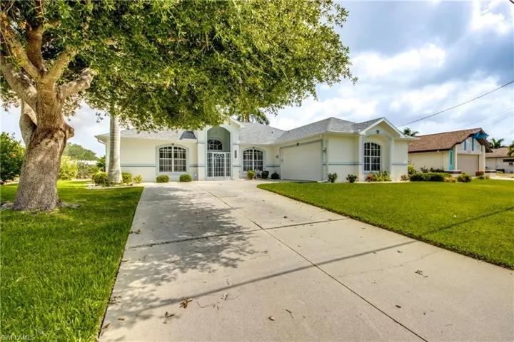 Loved Home with new roof 7/22, New Paint, Screened entry, side load garage