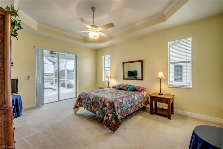 The Master Bedroom has high volume ceilings, large sliders, Trey Ceilings, and plenty of room