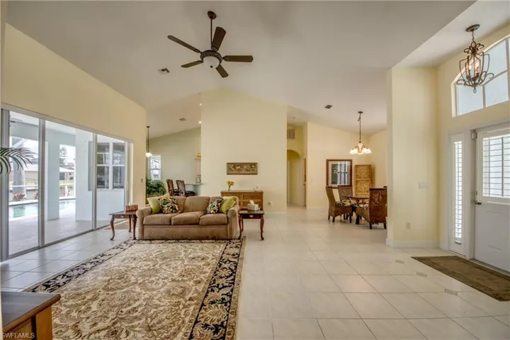 Enter through your Front Door with Sidelight into your Great Room Floor Plan and high cathedral ceilings.   Neutral Title throughout with carpet in the bedrooms.  Formal Dining Room is off Greatroom to the Right.